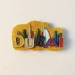 Front view of Dubai Burj Khalifa and Burj Al Arab Hotel fridge magnet, showcasing detailed landmarks.
