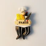 Front view of France Paris Painted Chef Fridge Magnet, depicting Parisian culinary art.