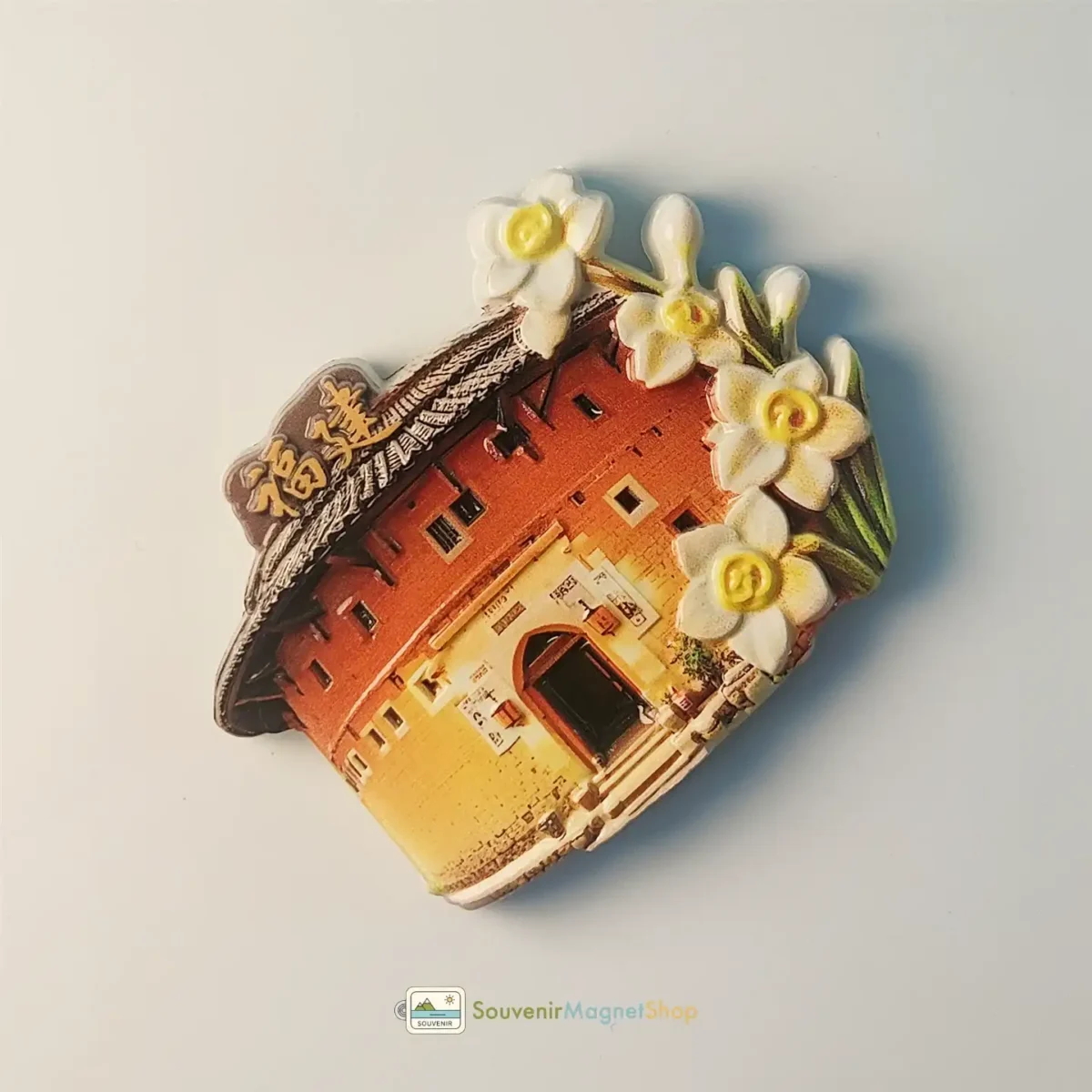 Left side view of China Fujian Tulou fridge magnet featuring Narcissus flowers