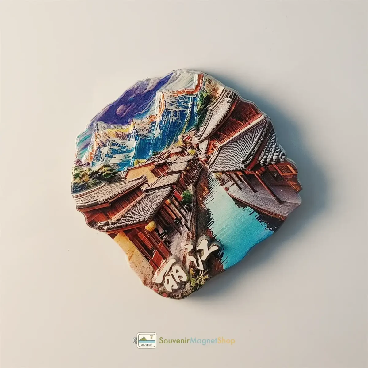 China Lijiang Old Town Snow Mountain fridge magnet left side view.