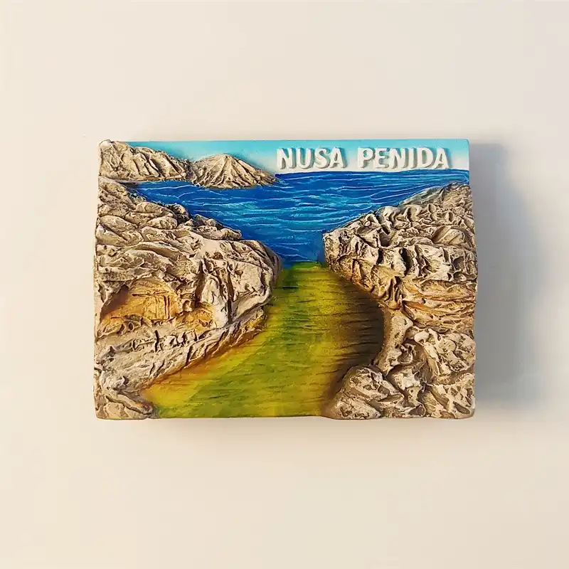 Hand-painted Indonesia Bali Nusa Penida Angel's Billabong fridge magnet showing the natural pool and rocky path.