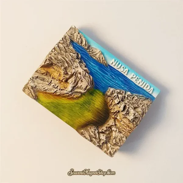 Unique travel gift magnet depicting the iconic Angel's Billabong natural pool and cliffs from Nusa Penida, Indonesia.