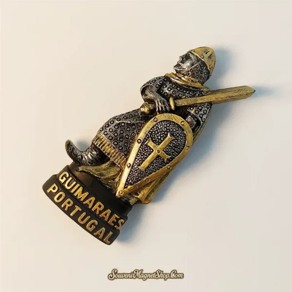 Close-up detail of Guimarães Portugal knight souvenir magnet highlighting hand-painted bronze craftsmanship