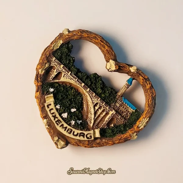 Unique travel gift magnet from Luxembourg, showcasing the Adolphe Bridge and Notre-Dame Cathedral in a heart-shaped design.