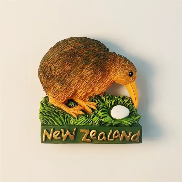 3D hand-painted New Zealand Kiwi bird hatching an egg on a green nest fridge magnet front view.