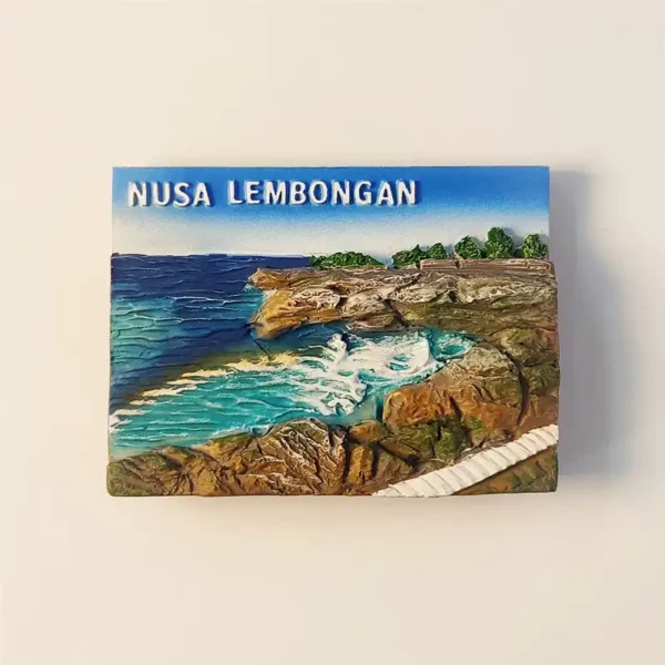 Front view of a 3D souvenir fridge magnet depicting Devil's Tears in Nusa Lembongan, with crashing waves and rugged cliffs.