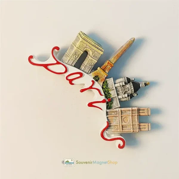 Close-up detail of Paris souvenir magnet highlighting hand-painted color craftsmanship and red script lettering