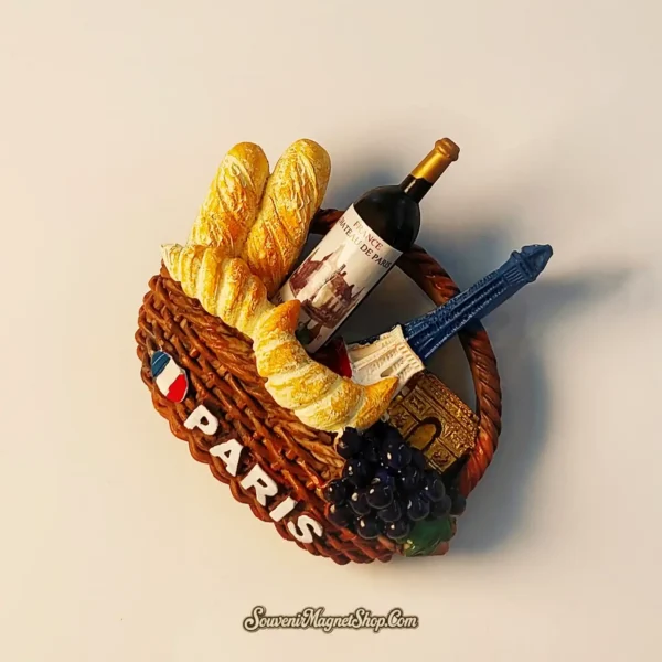 Unique Paris Eiffel Tower travel gift magnet, a charming basket filled with iconic French items.