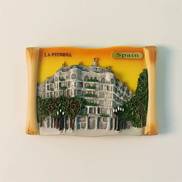 Front view of a 3D hand-painted souvenir fridge magnet depicting Barcelona's Casa Milà (La Pedrera) with a scroll design.