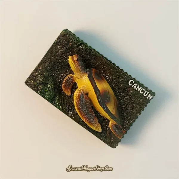 Close-up of a Cancun sea turtle travel gift magnet, highlighting the intricate design and the word "CANCUN", ideal for collectors.