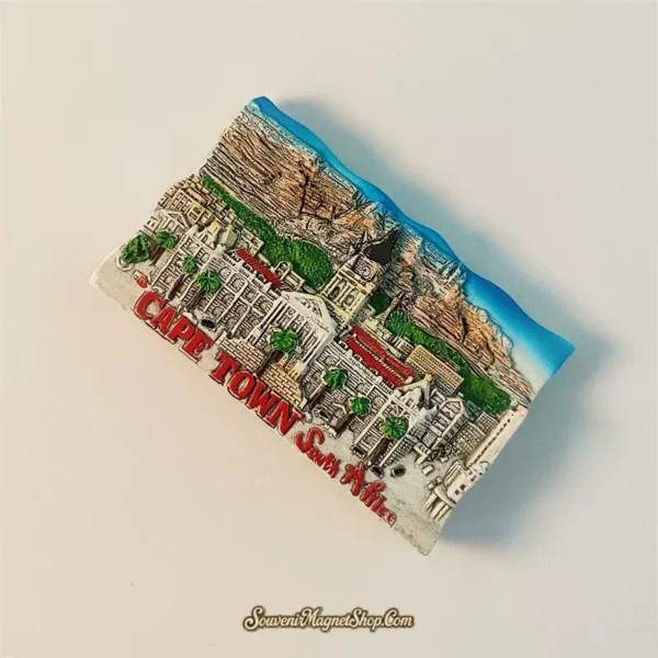 Overhead view of the Cape Town City Hall and Table Mountain travel gift magnet, emphasizing the craftsmanship and "CAPE TOWN South Africa" text.
