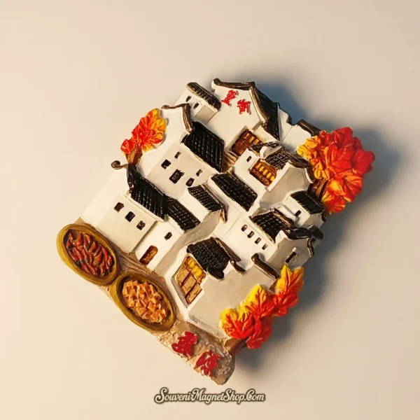 Hand-painted China Wuyuan Huangling travel gift magnet, depicting the unique terraced village landscape with traditional homes nestled amidst brilliant fall foliage, ideal for collectors and travelers.