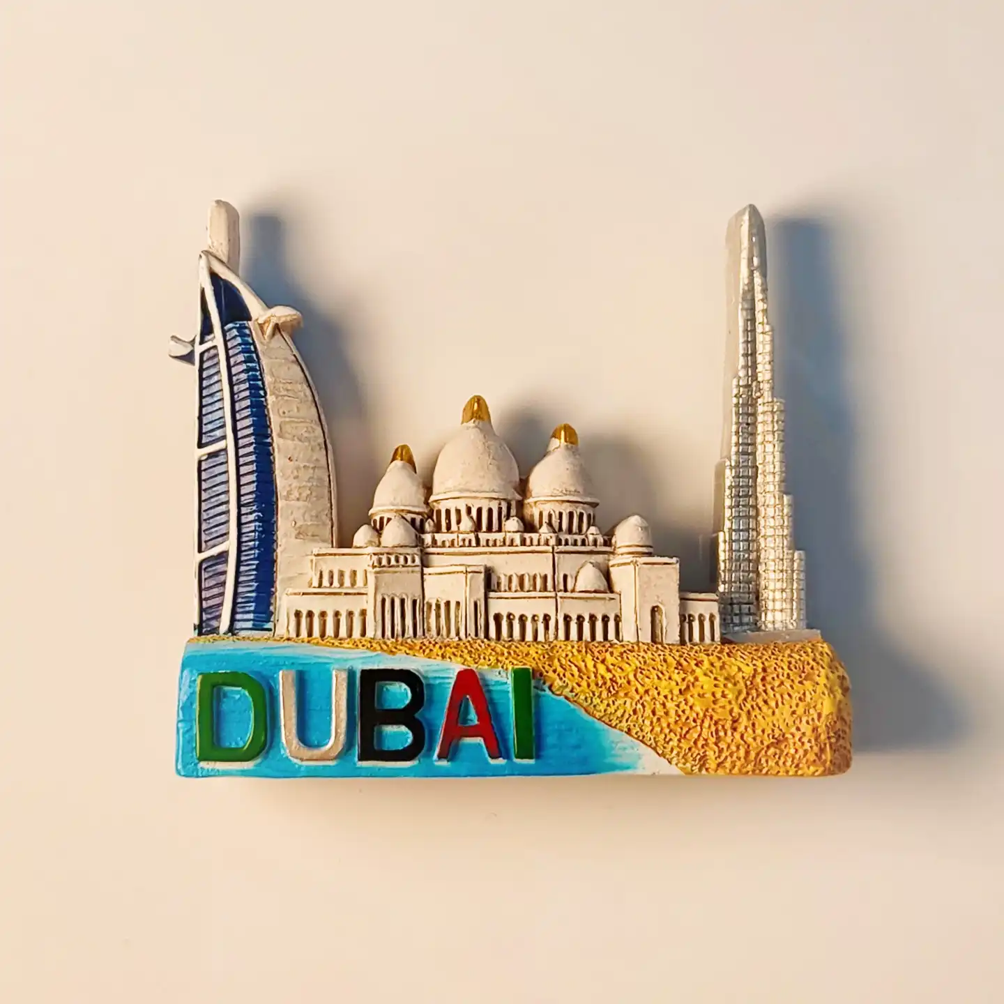 Front view of a 3D Dubai fridge magnet featuring the Burj Khalifa, Burj Al Arab, and Jumeirah Mosque.