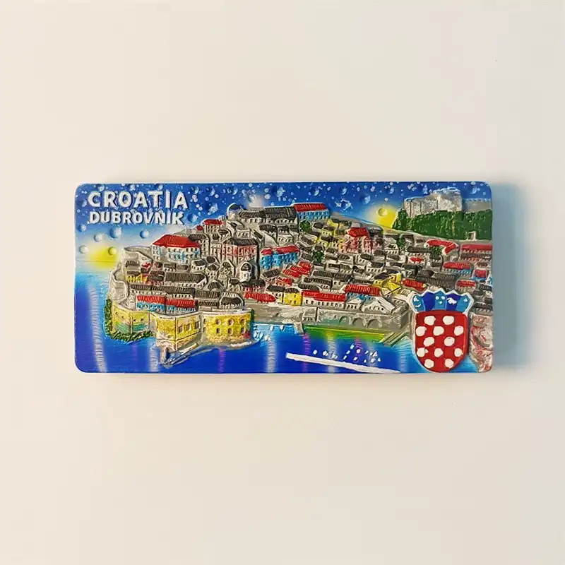 Front view of a detailed Dubrovnik Old Town cityscape fridge magnet, showcasing its vibrant red roofs and ancient stone walls by the Adriatic Sea.