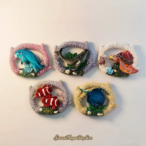 Semporna travel gift magnets featuring diverse marine life within a coral reef design, perfect for collectors and ocean lovers.