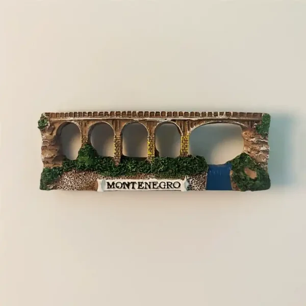 Front view of the hand-painted Montenegro Tara River Canyon Bridge fridge magnet, showcasing its arches and surrounding nature.