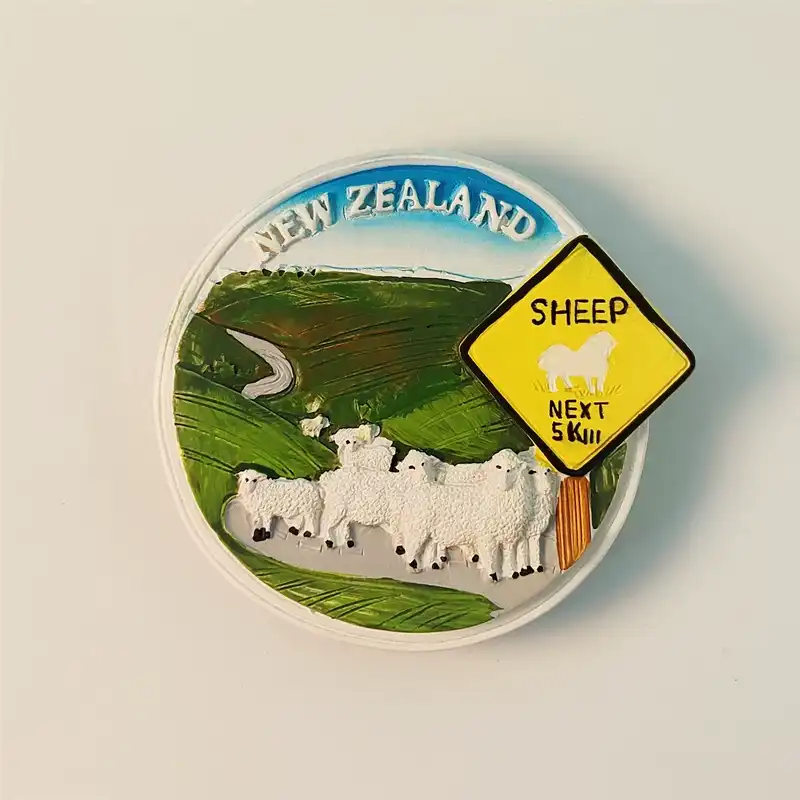 Front view of New Zealand sheep warning sign fridge magnet with green hills and white sheep.