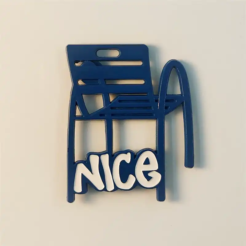 Front view of the iconic blue chair (Chaise Bleue) fridge magnet from Nice, France, featuring "NICE" text.