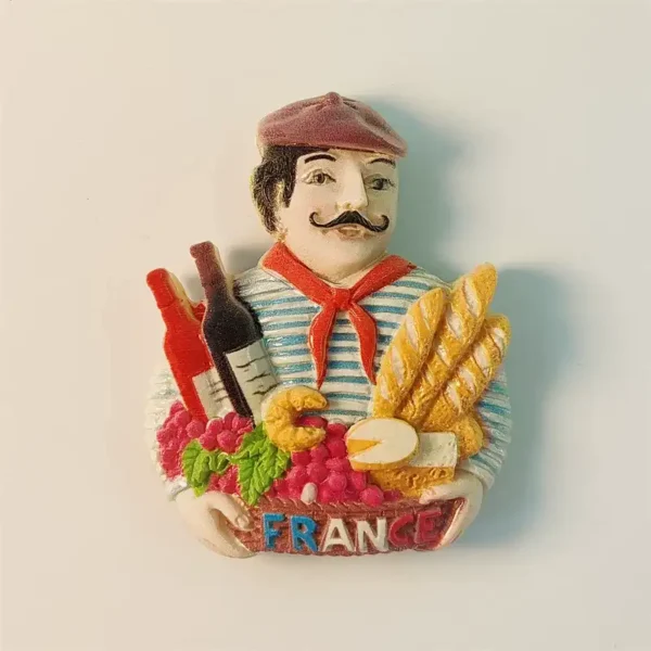 Front view of a colorful Paris France French Chef food and wine souvenir fridge magnet featuring baguettes, grapes, cheese, and wine bottles.