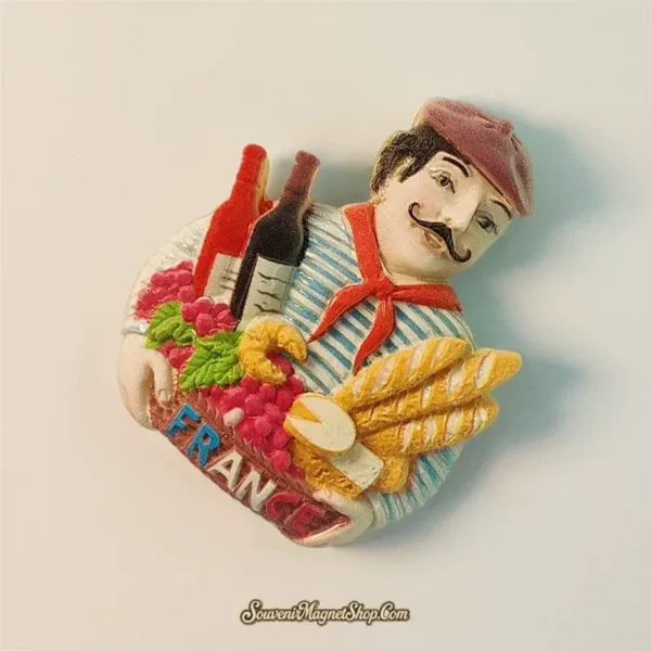 A perfect travel gift magnet from Paris France, depicting a French Chef with classic French food and wine elements.