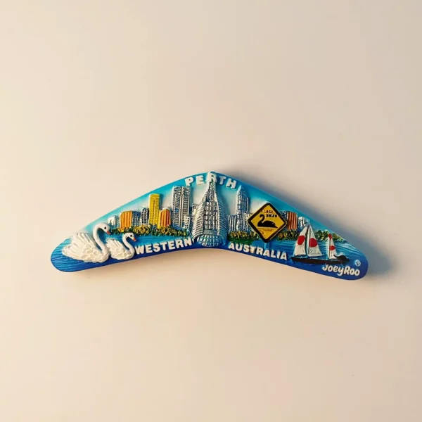 Front view of a detailed Perth, Australia boomerang fridge magnet featuring swans, cityscape, and sailboats.
