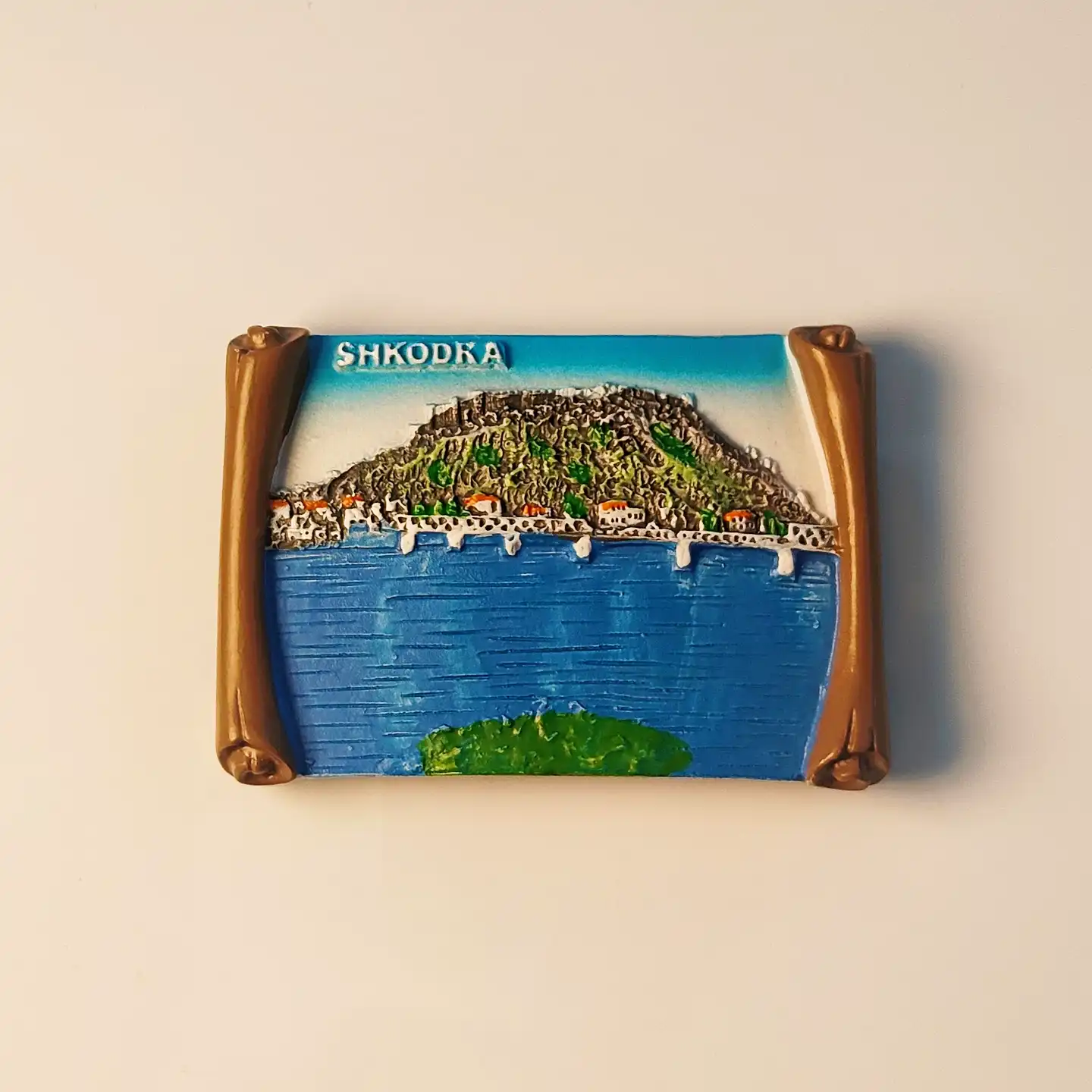 Front view of the detailed hand-painted Shkodra Rozafa Castle scroll fridge magnet.