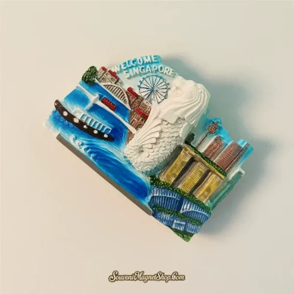 Angled view of a Singapore Merlion and Marina Bay Sands magnet, highlighting its value as a travel gift.