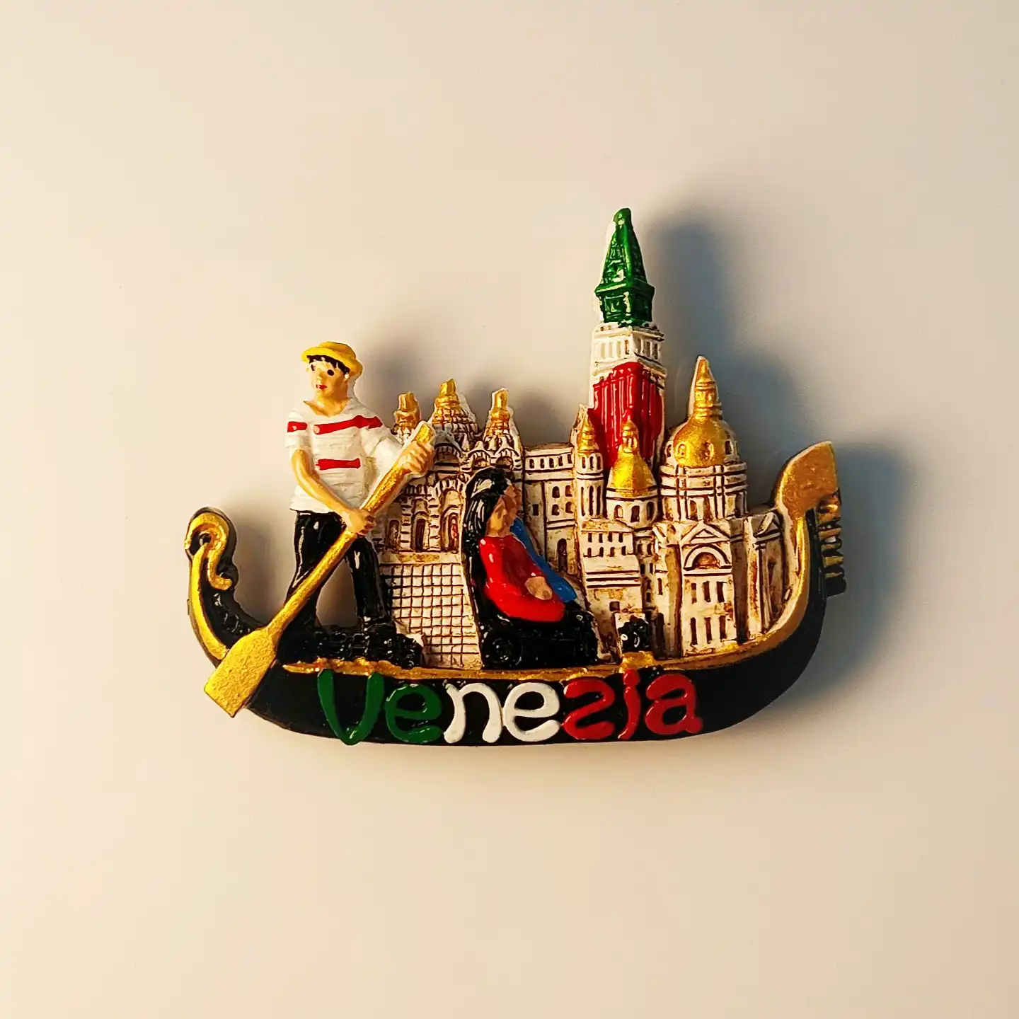 3D relief fridge magnet of a Venice gondola with a gondolier and St. Mark's Campanile in the background.
