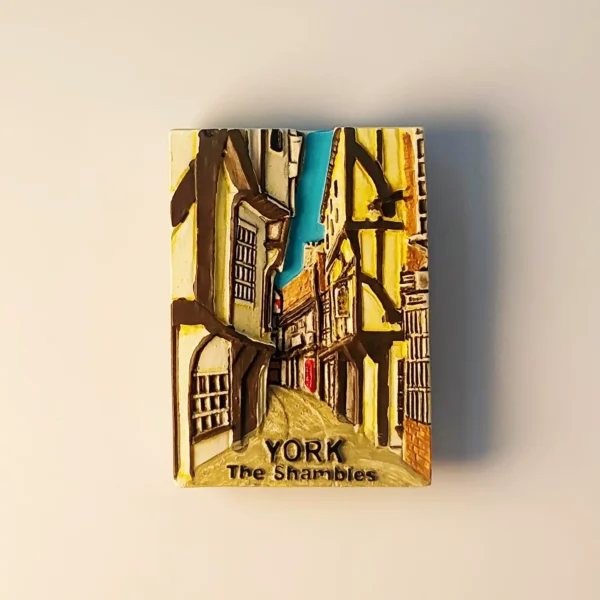 3D relief fridge magnet of The Shambles street in York, England featuring iconic overhanging medieval buildings.