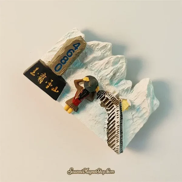 Close-up of the Yunnan Jade Dragon Snow Mountain magnet, perfect as a travel gift, showing intricate details of the cable car path and snowy landscape.