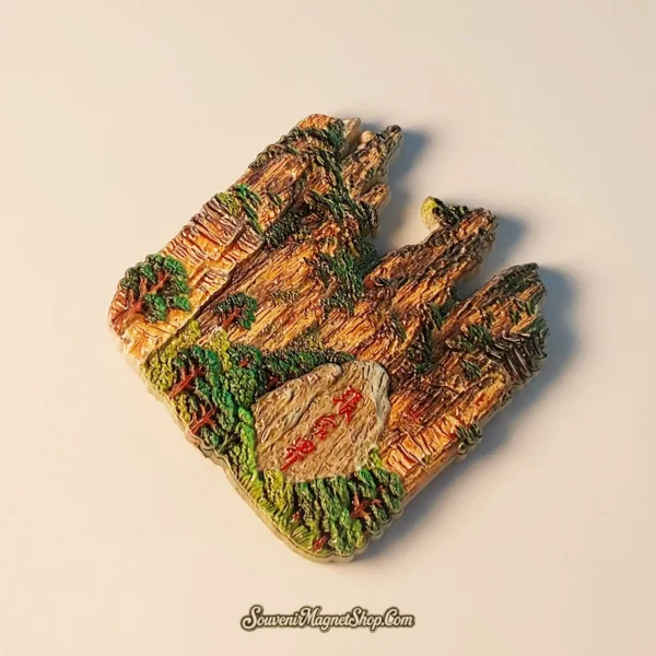 Overhead angled view of the Zhangjiajie Wulingyuan Peak Forest travel gift magnet, perfect for commemorating a trip or gifting.