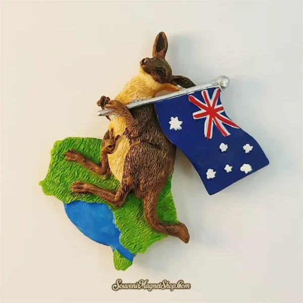 Angled view of Australia kangaroo souvenir magnet holding flag on continent map base