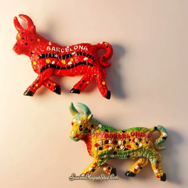 Close-up of Gaudí-style mosaic bull magnets with Barcelona text, showcasing intricate 3D craftsmanship and Mediterranean colors.