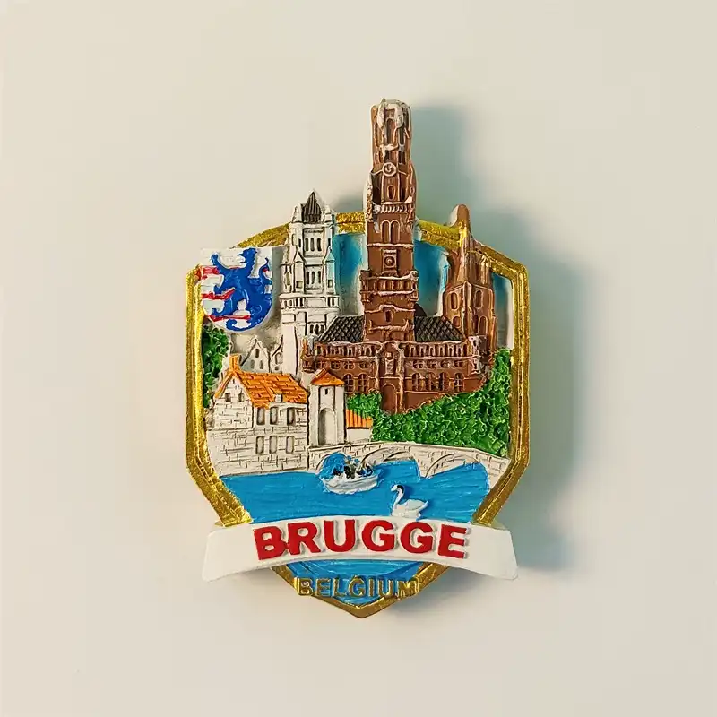 Belgium Bruges fridge magnet front view featuring Belfry Tower, canal with swans, and blue lion coat of arms