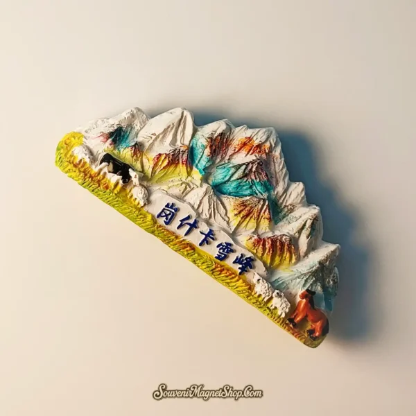 Side view of China's Gangshika Snow Peak travel gift magnet, highlighting its 3D relief and vibrant artistic details.