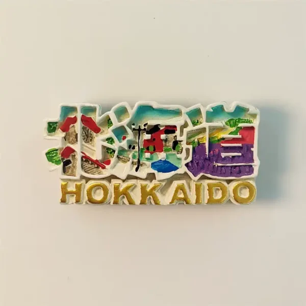 Front view of a colorful 3D Hokkaido Japan lettering fridge magnet, showing scenic elements within the letters.
