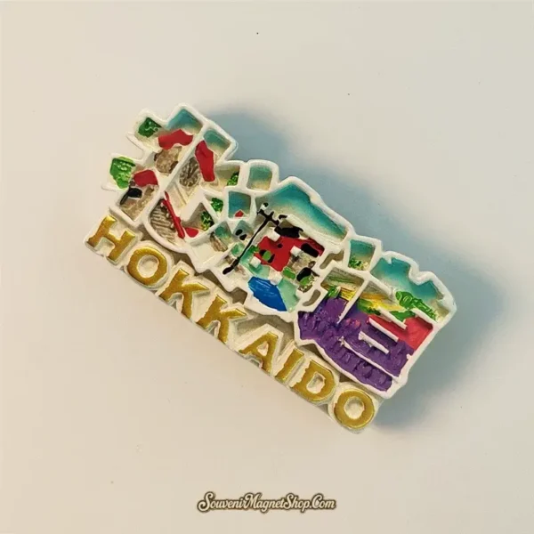Close-up, slightly angled view of a Hokkaido Japan travel gift magnet, showcasing its detailed craftsmanship and "Hokkaido" text.