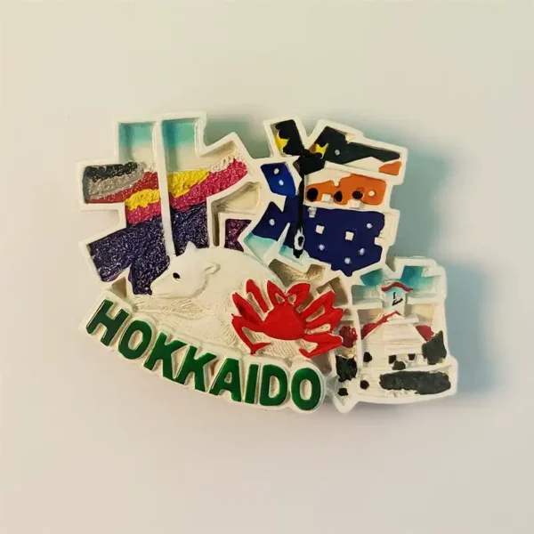 Front view of a detailed Hokkaido polar bear and king crab fridge magnet, featuring the word 'HOKKAI'