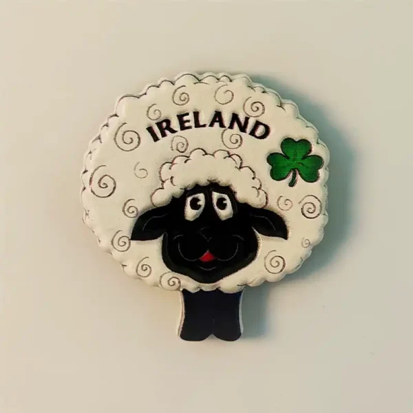 Ireland black sheep fridge magnet front view showing round woolly white body with black face, IRELAND lettering, and green shamrock detail