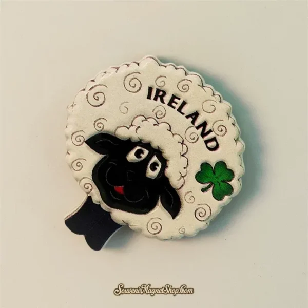 Angled view of Ireland black sheep souvenir magnet highlighting green shamrock emblem and golden swirl wool texture