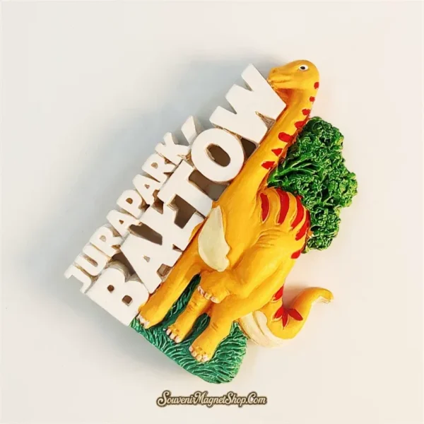 JuraPark Baltow Poland fridge magnet left-front angle showing 3D depth of brachiosaurus dinosaur and raised JURAPARK text