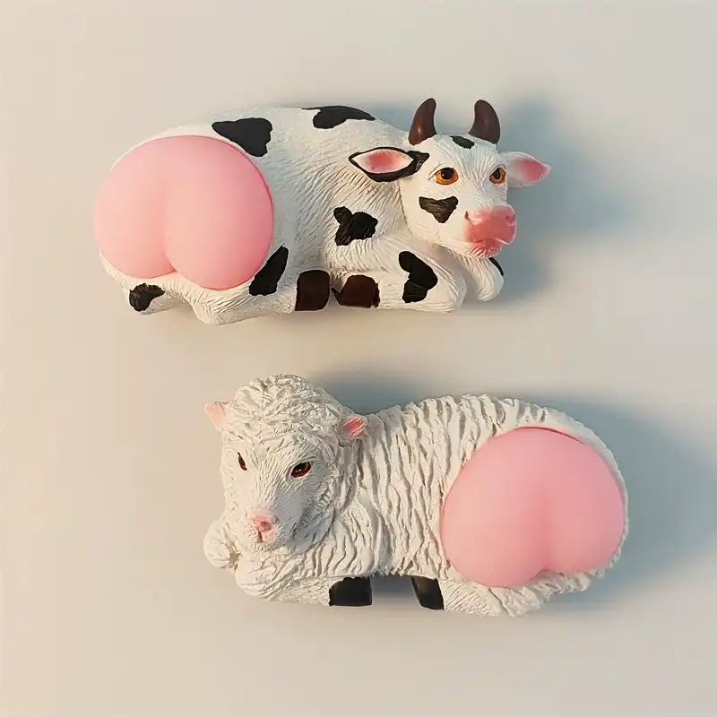 kashgar-xinjiang-cow-sheep-pink-butt-fridge-magnet-front A pair of funny Xinjiang Kashgar souvenir magnets featuring a cow and a sheep with cute pink butts.