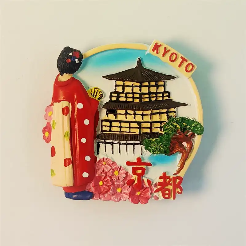 Front view of a hand-painted Kyoto souvenir fridge magnet featuring a traditional Japanese woman in a kimono and a historic pagoda with cherry blossoms.