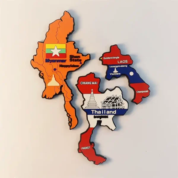 Close-up of the Golden Triangle souvenir magnet set including Myanmar, Thailand, and Laos with iconic temple silhouettes.