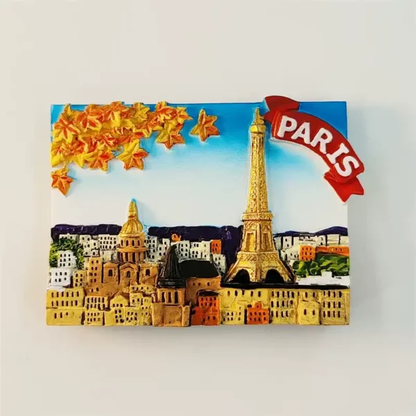 Front view of Paris souvenir fridge magnet with 3D gold Eiffel Tower, autumn maple leaves and warm golden cityscape relief