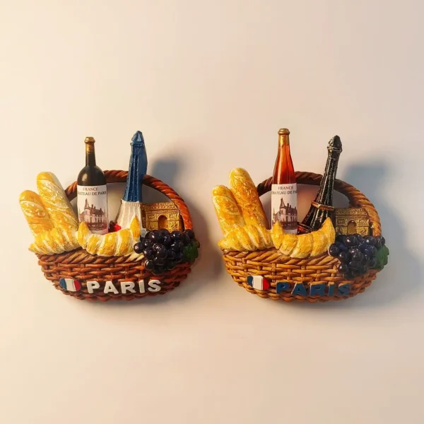 Set of two Paris souvenir fridge magnets featuring the Eiffel Tower, Arc de Triomphe, and French gourmet picnic elements.