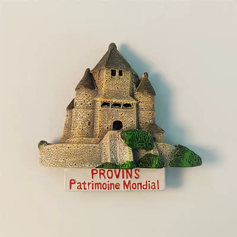 Front view of the France Provins Caesar's Tower souvenir fridge magnet, showcasing its medieval architecture and 'PROVINS Patrimoine Mondial' inscription.