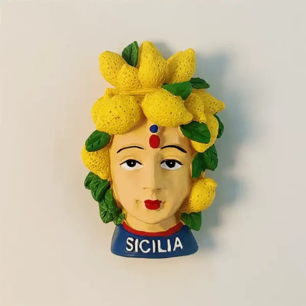 Front view of a vibrant Sicilian Moorish Head fridge magnet adorned with yellow lemons, with the word "SICILIA" at the base.