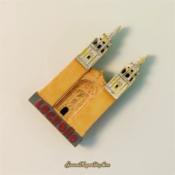 Angled view of Logroño Spain souvenir magnet showing 3D depth of twin bell towers and carved stone portal