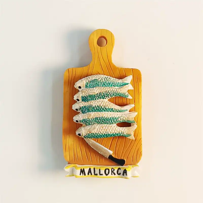 Spain Mallorca sardines souvenir fridge magnet front view, cutting board shape with 3D green-white fish and kitchen knife